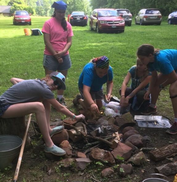 Girl Scouts starting a campfire