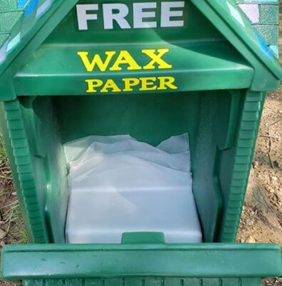 Girl Scouts showing how to use their wax paper container