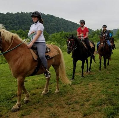 Girl Scouts on horseback riding trip