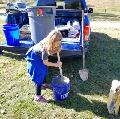 Daisy Scout mixing cement