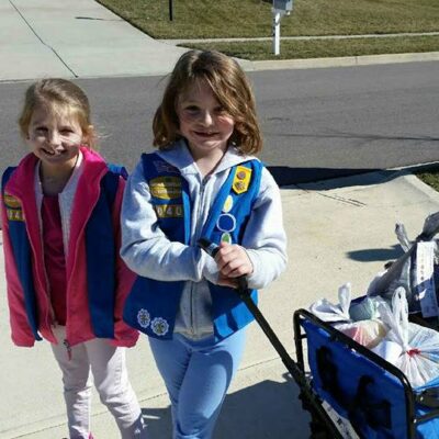 Girl Scouts delivering cookies